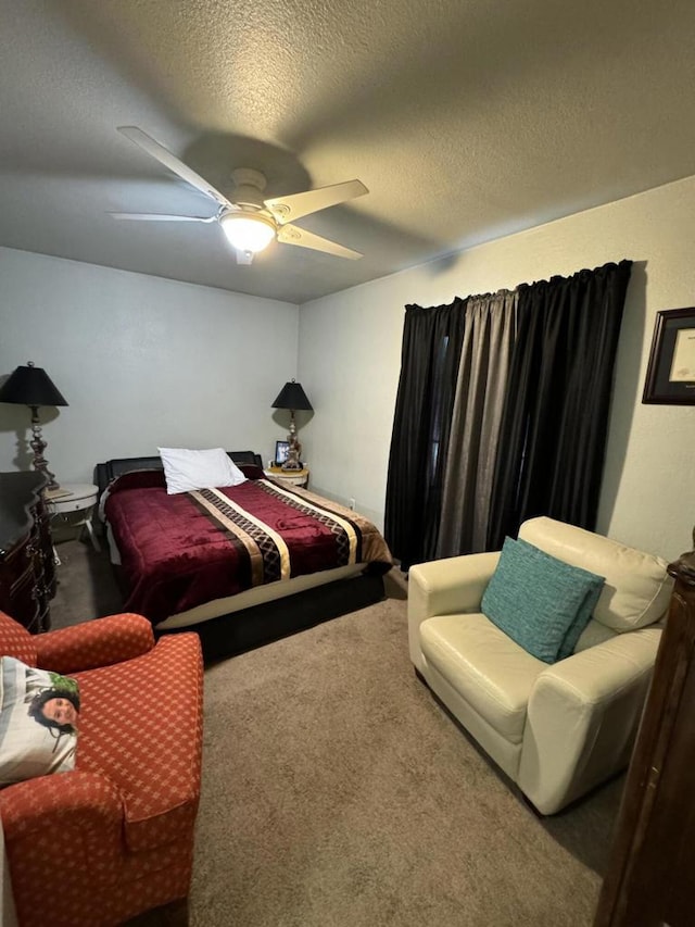 bedroom featuring ceiling fan, carpet flooring, and a textured ceiling