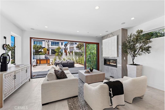 living room featuring a premium fireplace