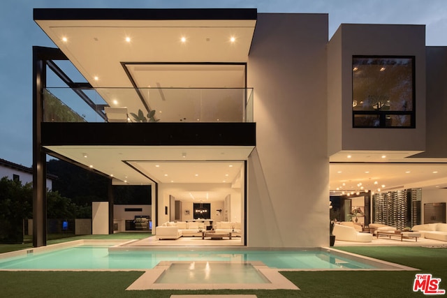 view of swimming pool with an outdoor hangout area and a patio