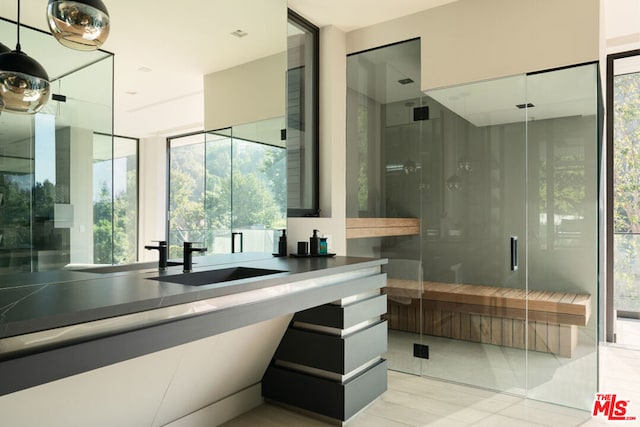 bathroom with an enclosed shower and vanity