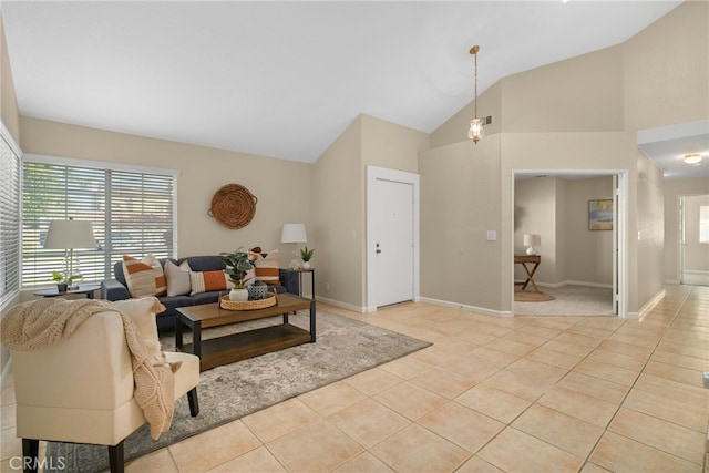 tiled living room with high vaulted ceiling