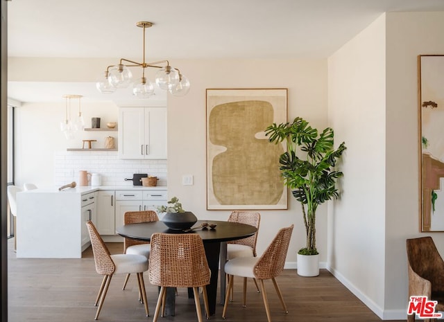 dining room featuring a chandelier and dark hardwood / wood-style flooring