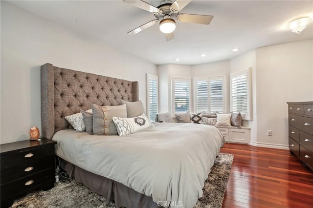 bedroom featuring ceiling fan and dark hardwood / wood-style floors