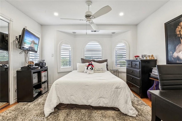 bedroom featuring ceiling fan and wood-type flooring