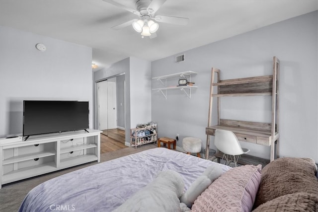 bedroom featuring a closet, ceiling fan, and hardwood / wood-style floors