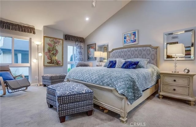 bedroom featuring high vaulted ceiling and carpet