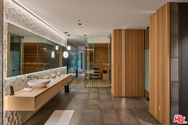 bathroom with decorative backsplash and vanity