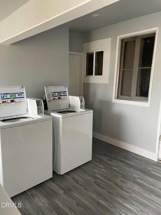 laundry area with washer and clothes dryer and dark hardwood / wood-style floors