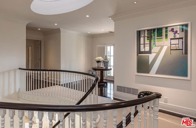 staircase featuring crown molding