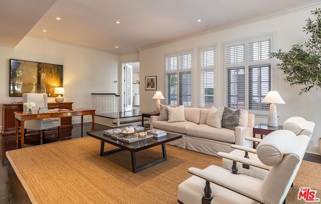 living room with ornamental molding and hardwood / wood-style flooring