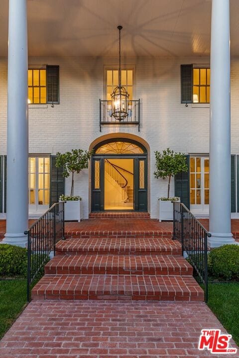 view of exterior entry featuring french doors