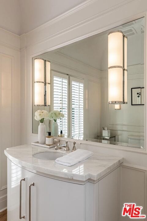 interior space featuring ornamental molding and sink