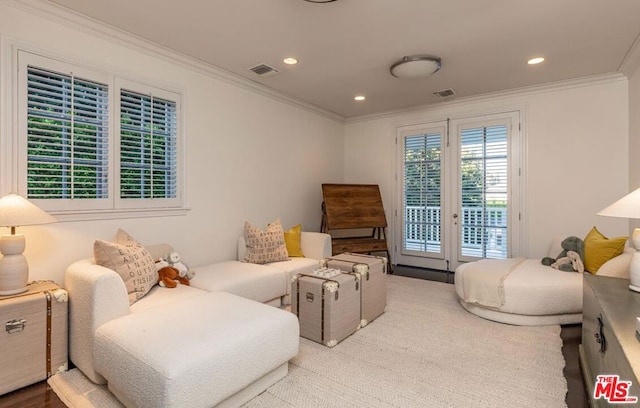 sitting room featuring ornamental molding