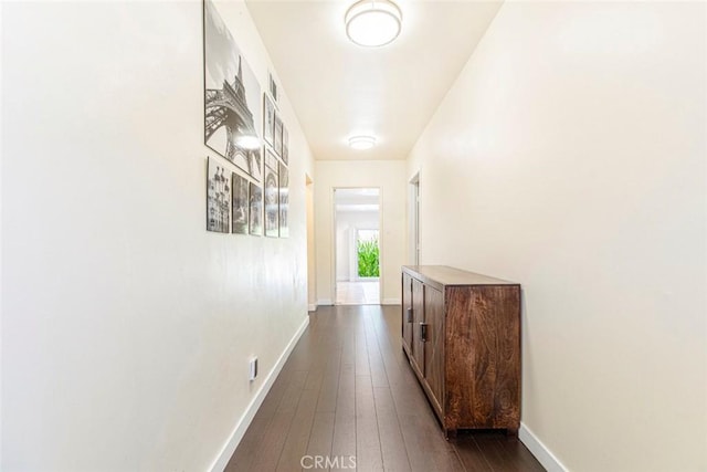 hall with dark hardwood / wood-style floors