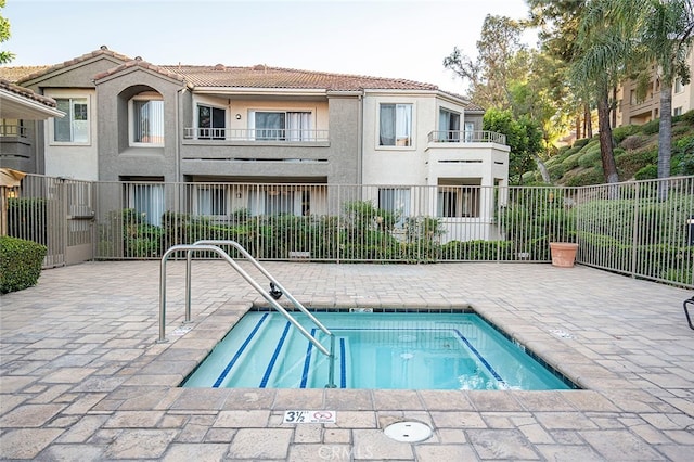 view of swimming pool featuring a patio