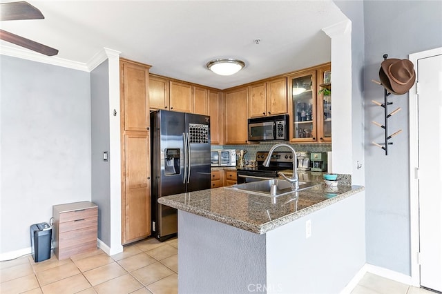 kitchen featuring kitchen peninsula, dark stone countertops, crown molding, stainless steel electric range, and refrigerator with ice dispenser