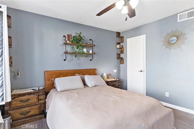 bedroom featuring dark wood-type flooring and ceiling fan