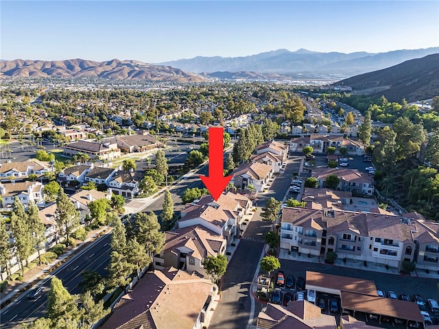 birds eye view of property featuring a mountain view