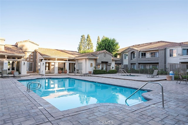 view of swimming pool featuring a patio area