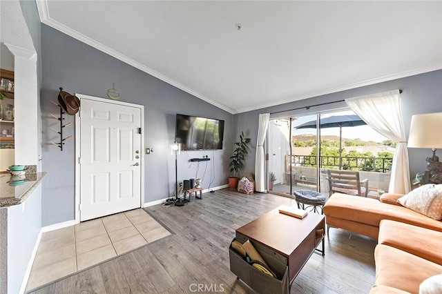 living room featuring light hardwood / wood-style floors, ornamental molding, and lofted ceiling