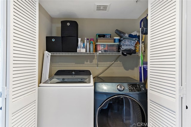 laundry room with independent washer and dryer