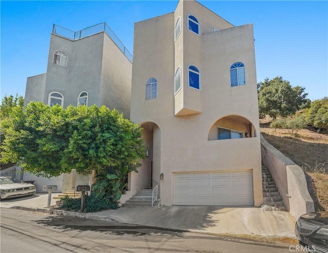 view of front of property featuring a garage