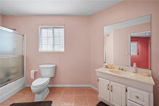 full bathroom featuring bath / shower combo with glass door, tile patterned floors, vanity, and toilet