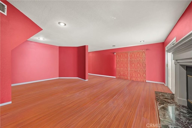 unfurnished living room featuring wood-type flooring