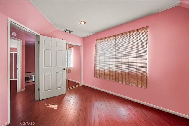 unfurnished bedroom featuring wood-type flooring