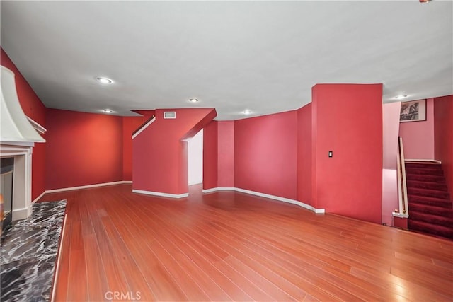 unfurnished living room featuring hardwood / wood-style flooring