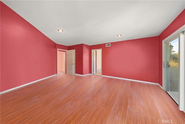 unfurnished room with light hardwood / wood-style flooring