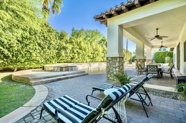 view of patio / terrace featuring ceiling fan