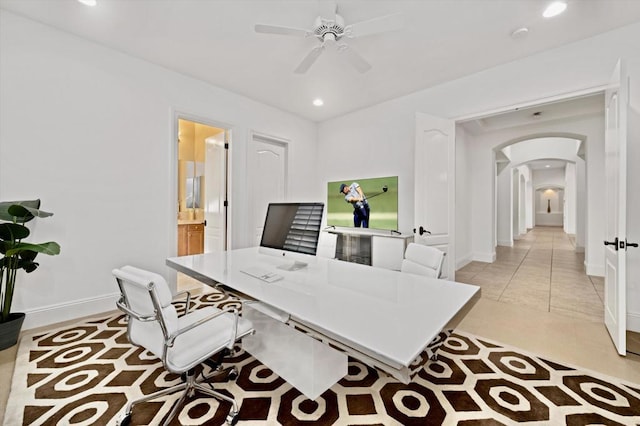 tiled office featuring ceiling fan