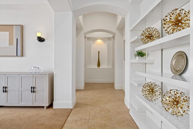 hallway featuring light tile patterned flooring