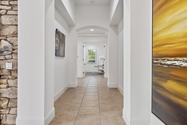 corridor featuring light tile patterned flooring