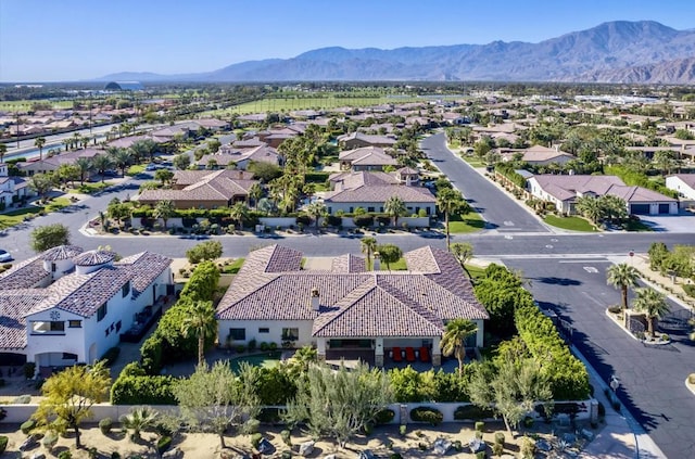 birds eye view of property featuring a mountain view