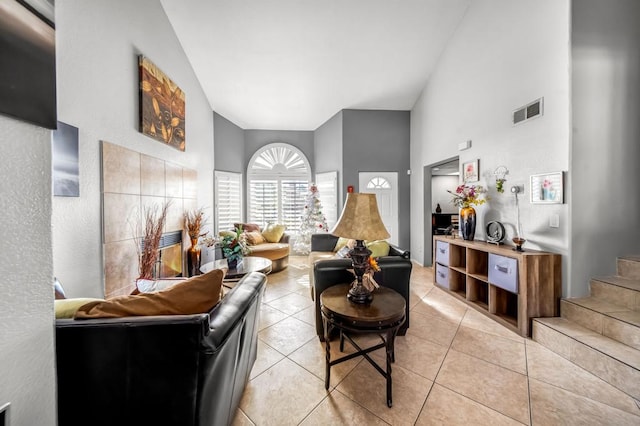 tiled living room featuring vaulted ceiling