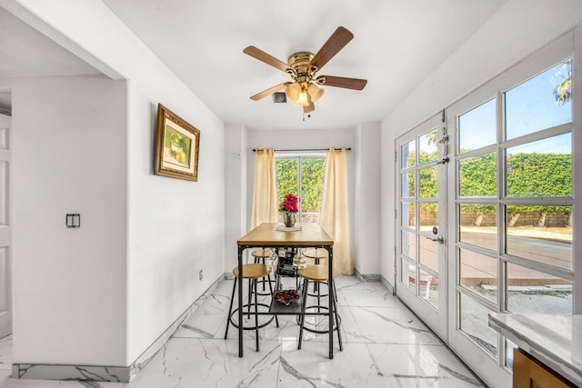 sunroom / solarium with ceiling fan