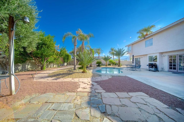 view of swimming pool featuring a patio area