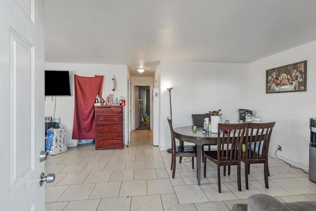 dining space featuring light tile patterned floors