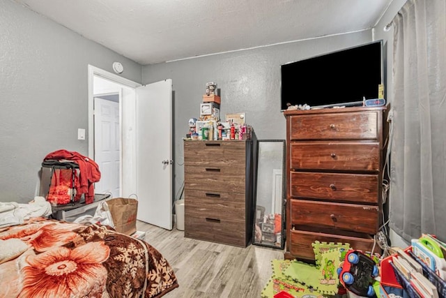 bedroom with light hardwood / wood-style flooring