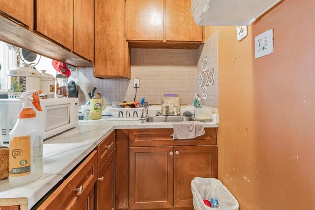 kitchen with decorative backsplash and sink