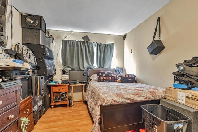 bedroom with light wood-type flooring