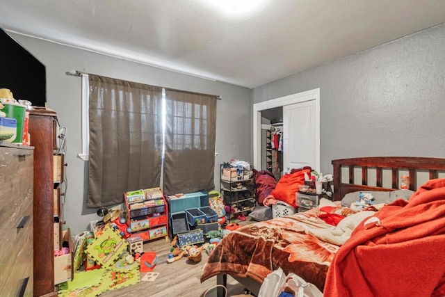 bedroom featuring a closet and hardwood / wood-style floors