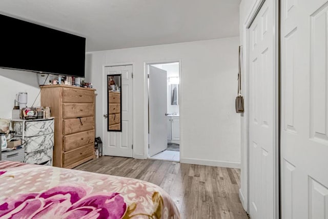 bedroom with light hardwood / wood-style flooring