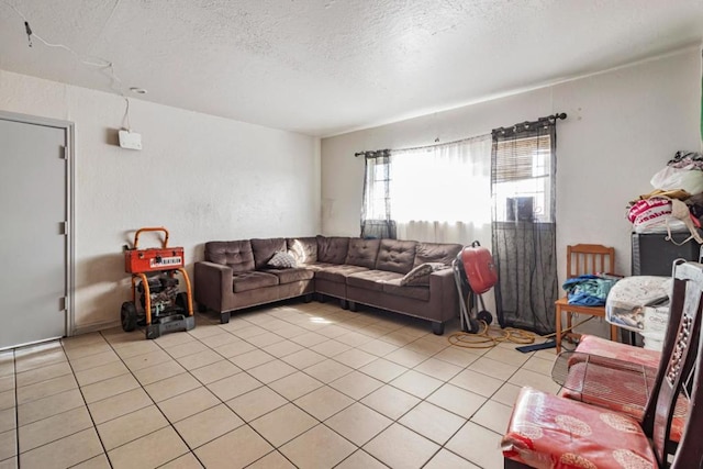 tiled living room featuring a textured ceiling