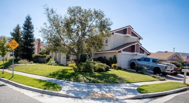 view of front facade with a garage and a front yard