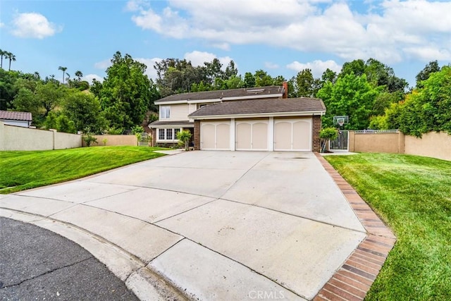 view of front of property with a garage and a front yard