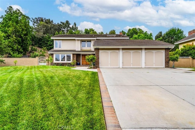 view of front of home featuring a front yard and a garage