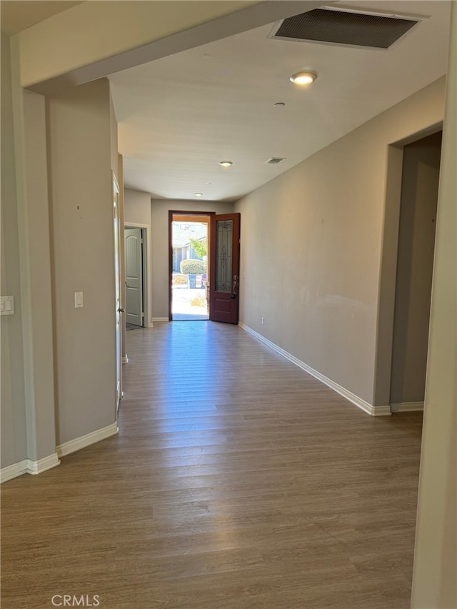 spare room with hardwood / wood-style flooring